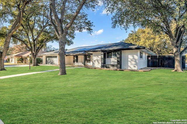 single story home with a garage and a front yard