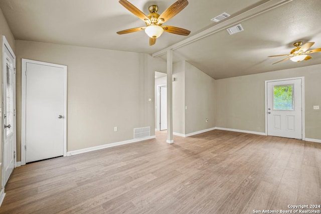 unfurnished living room with ceiling fan, light hardwood / wood-style flooring, and lofted ceiling