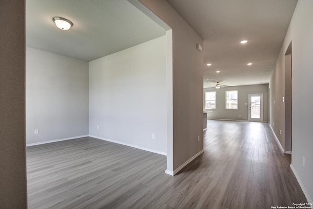 unfurnished room featuring ceiling fan and wood-type flooring