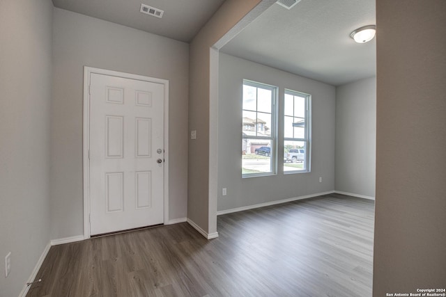 entryway with hardwood / wood-style flooring