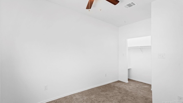 carpeted empty room with ceiling fan