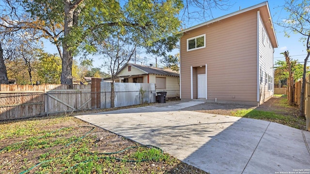 rear view of property featuring a patio