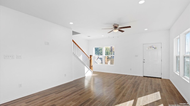 unfurnished living room with hardwood / wood-style floors and ceiling fan