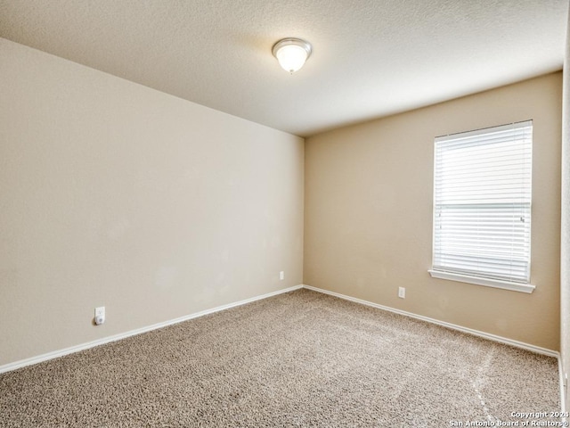 unfurnished room featuring carpet floors