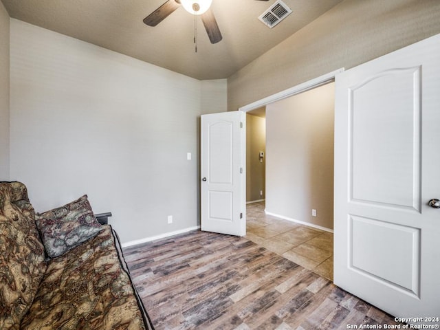 sitting room featuring hardwood / wood-style floors and ceiling fan