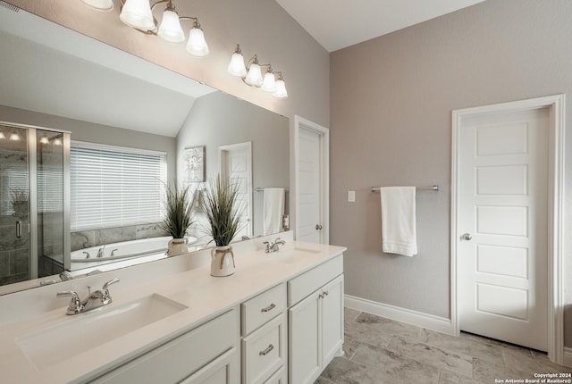 bathroom with vanity, lofted ceiling, and shower with separate bathtub