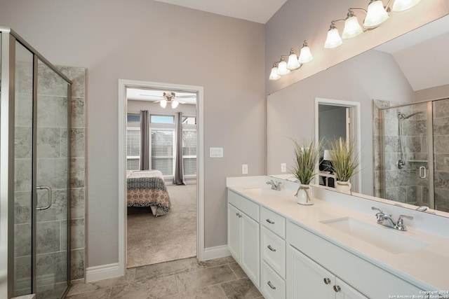 bathroom featuring ceiling fan, a shower with shower door, vanity, and lofted ceiling