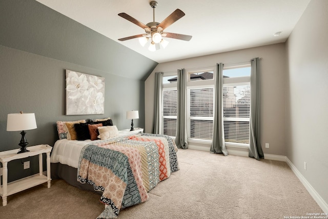 carpeted bedroom with vaulted ceiling and ceiling fan