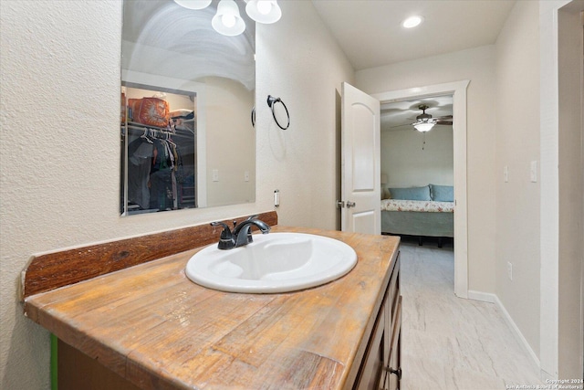 bathroom with vanity and ceiling fan