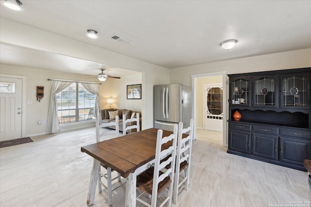 dining space with ceiling fan