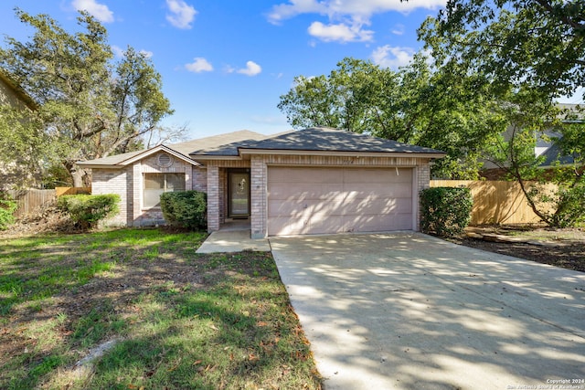 ranch-style home with a garage