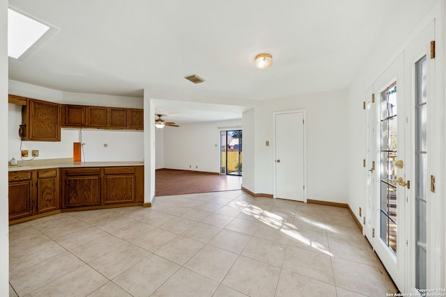 kitchen featuring ceiling fan and light tile patterned floors