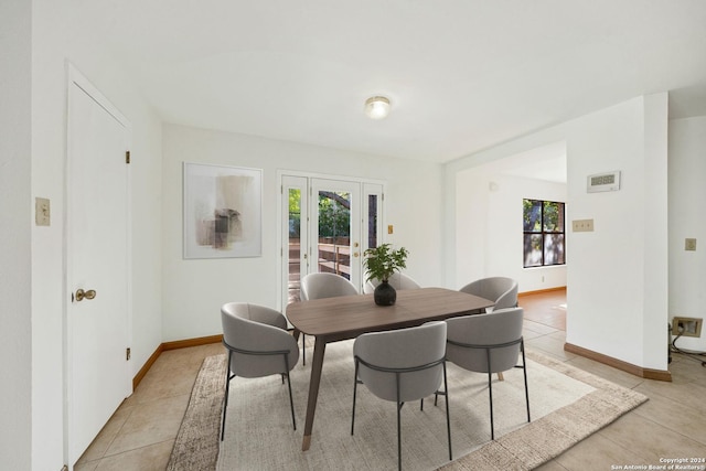 dining space with light tile patterned flooring