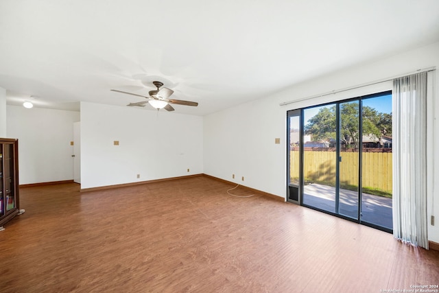 unfurnished room featuring ceiling fan and hardwood / wood-style floors