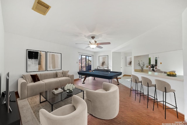 living room featuring ceiling fan, french doors, billiards, and light hardwood / wood-style flooring