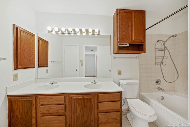 full bathroom with vanity, toilet, and tiled shower / bath