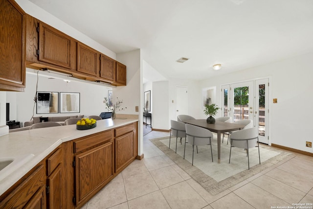 kitchen with light tile patterned flooring