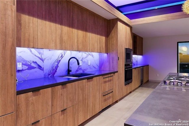 kitchen with decorative backsplash, stainless steel appliances, light tile patterned flooring, and sink