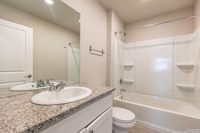 full bathroom with vanity, shower / bath combination, and toilet