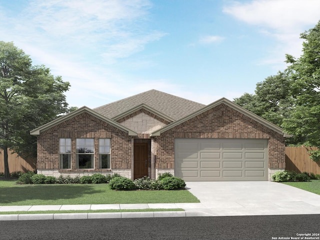 view of front of house with a front yard and a garage