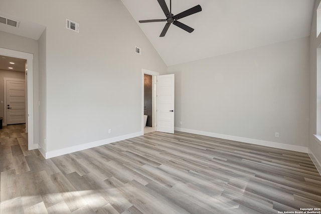 interior space featuring light hardwood / wood-style floors, high vaulted ceiling, and ceiling fan