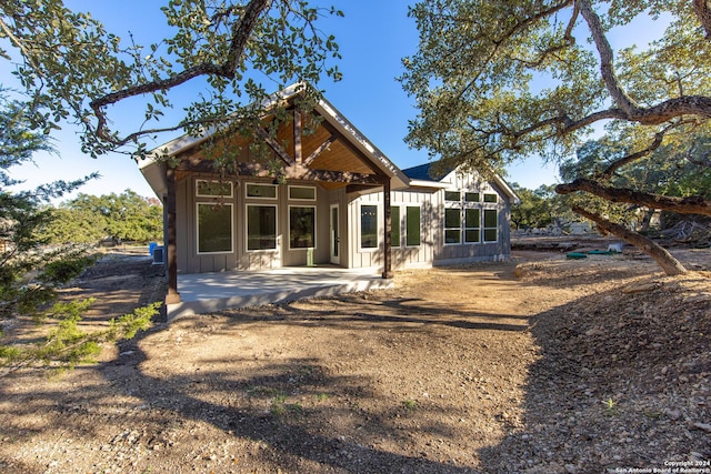 back of house with a patio