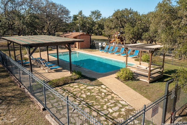 view of swimming pool featuring a pergola and a patio area