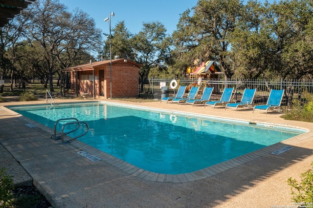 view of swimming pool featuring a patio