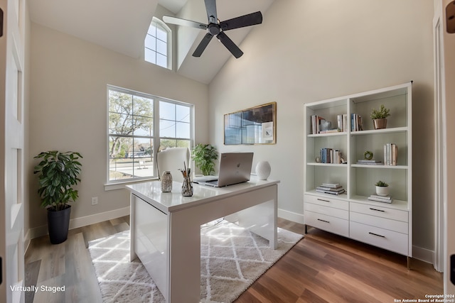 office space featuring hardwood / wood-style flooring, high vaulted ceiling, and ceiling fan