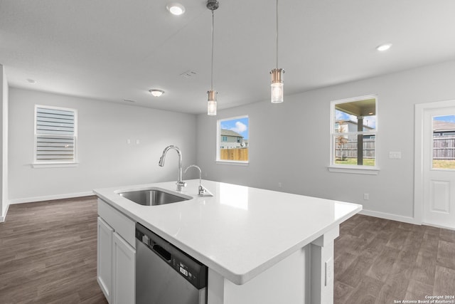 kitchen featuring white cabinetry, dishwasher, sink, pendant lighting, and a center island with sink