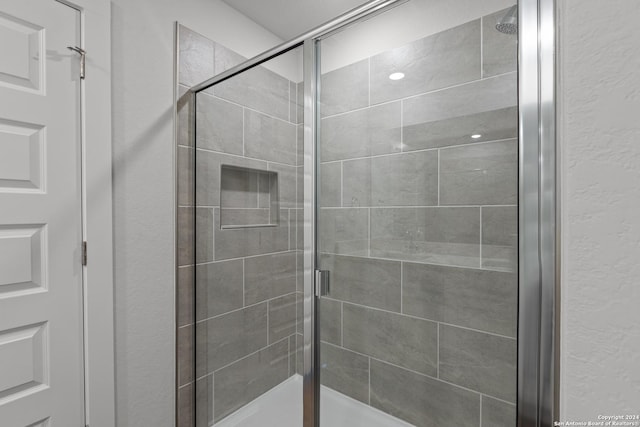 bathroom with an enclosed shower