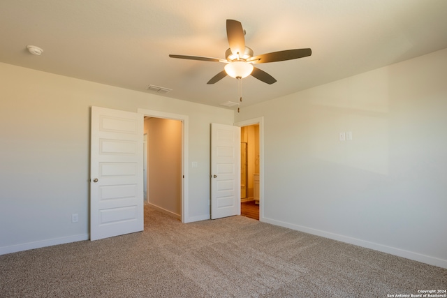 unfurnished bedroom featuring carpet and ceiling fan