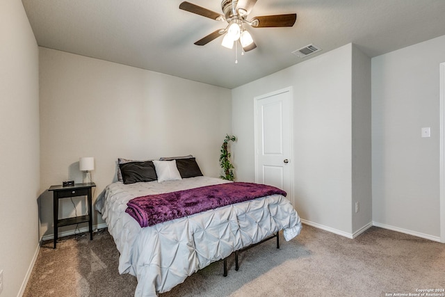 bedroom with ceiling fan and carpet