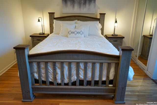 bedroom featuring dark hardwood / wood-style flooring