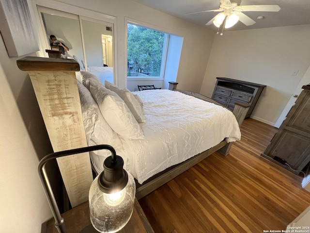 bedroom with hardwood / wood-style flooring and ceiling fan