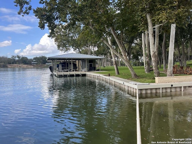 dock area featuring a water view