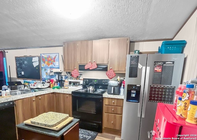 kitchen with a textured ceiling, sink, light hardwood / wood-style flooring, and black appliances