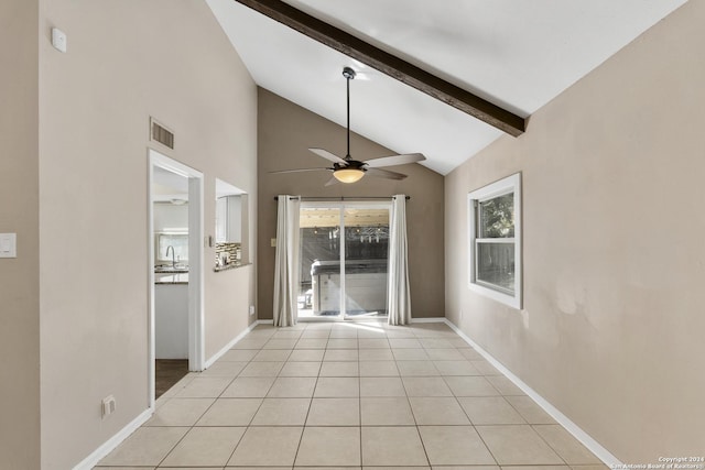 interior space with vaulted ceiling with beams, sink, and light tile patterned floors