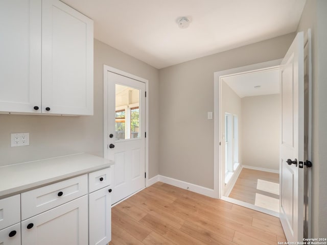 doorway with light hardwood / wood-style floors