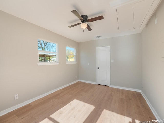 unfurnished room featuring ceiling fan and light hardwood / wood-style floors