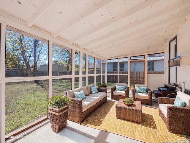 sunroom with lofted ceiling with beams