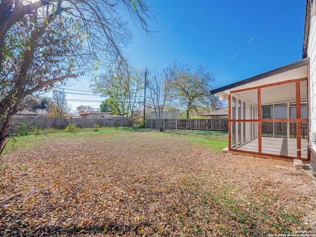 view of yard featuring a sunroom