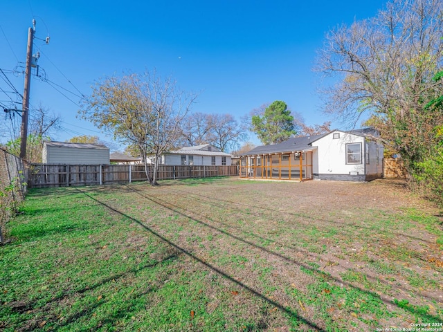 view of yard with a sunroom