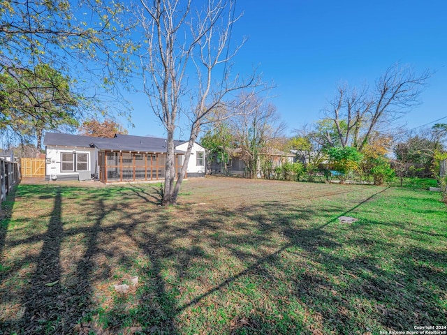 view of yard featuring a sunroom