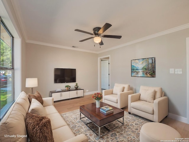 living room with ceiling fan, light hardwood / wood-style floors, and ornamental molding