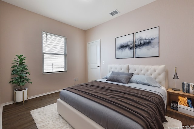 bedroom featuring dark hardwood / wood-style floors