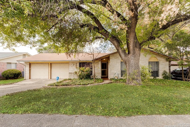 view of front of home with a garage and a front yard