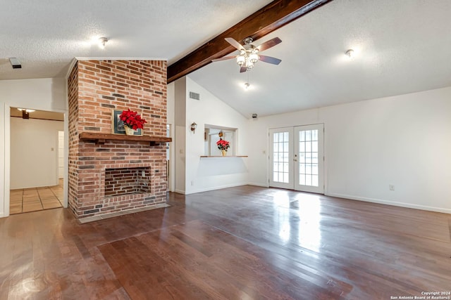 unfurnished living room with a textured ceiling, vaulted ceiling with beams, and dark wood-type flooring