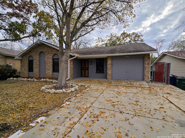 ranch-style home featuring a garage