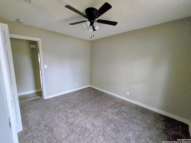 carpeted empty room with ornamental molding, a textured ceiling, and ceiling fan